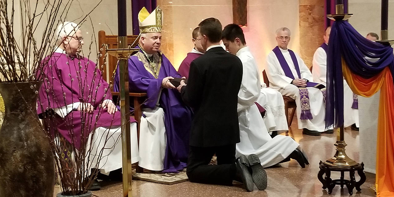 Four men take another step in their journey to service in the permanent diaconate