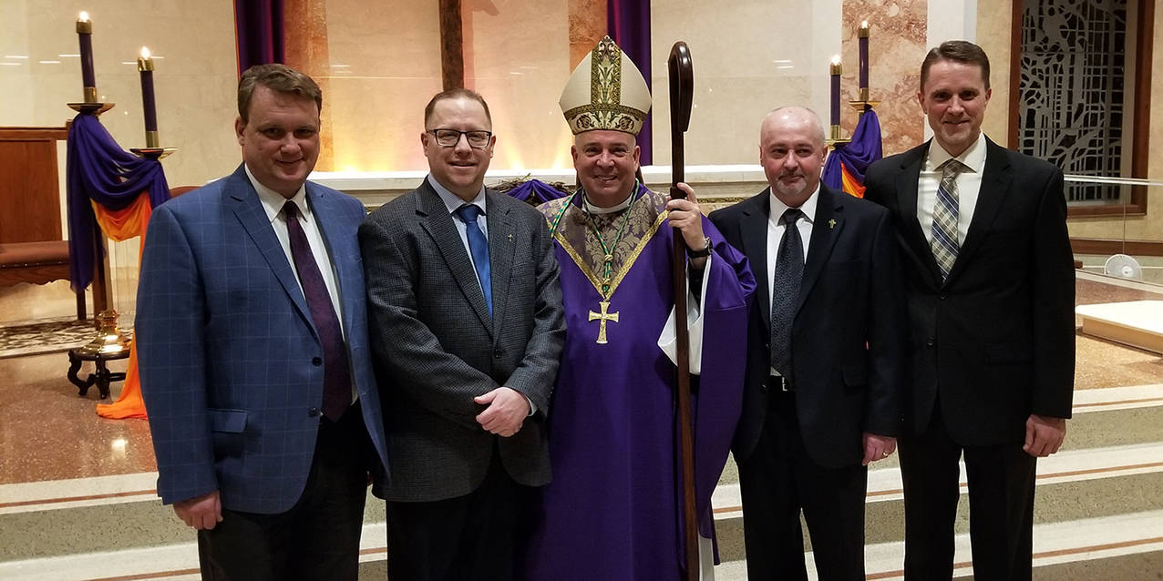 Four men take another step in their journey to service in the permanent diaconate