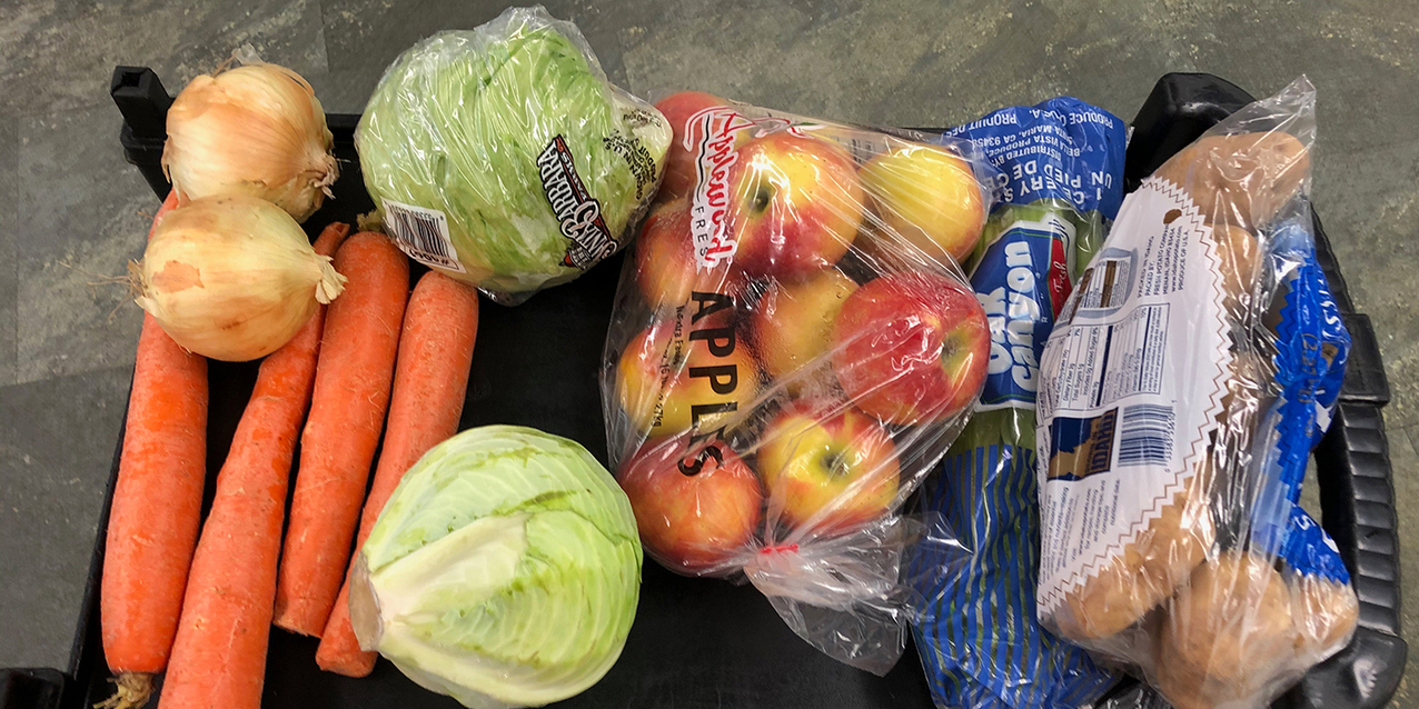 Catholic Charities distributes boxes of produce to hunger centers, those in need