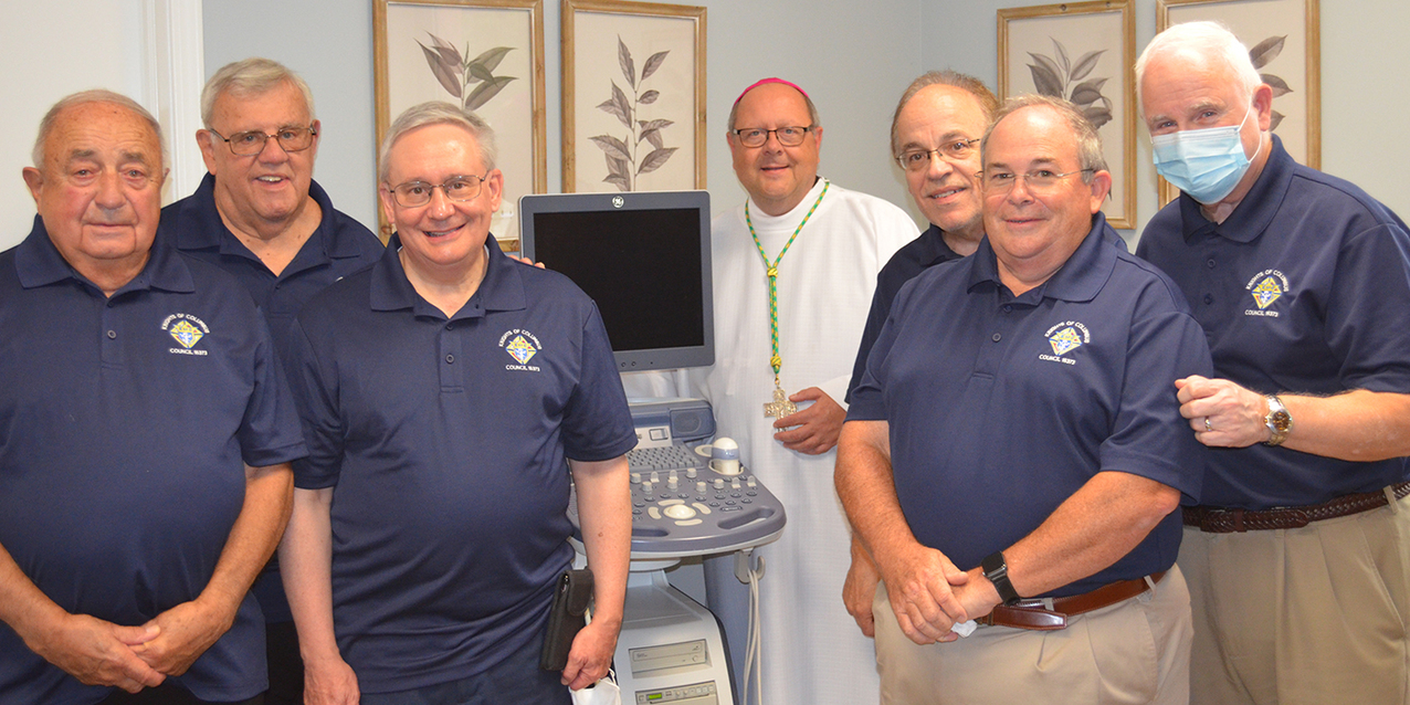 Ultrasound machine donated by St. Ladislas Knights of Columbus is blessed by bishop