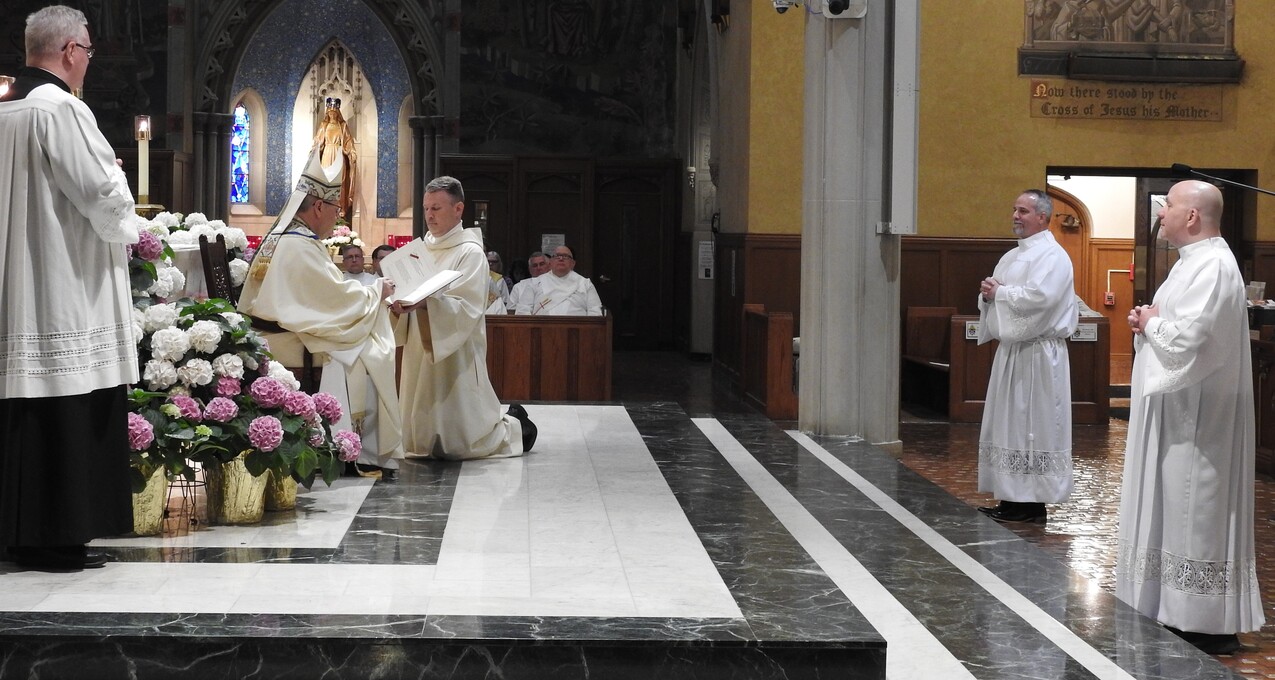 Two men ordained for ministry as permanent deacons