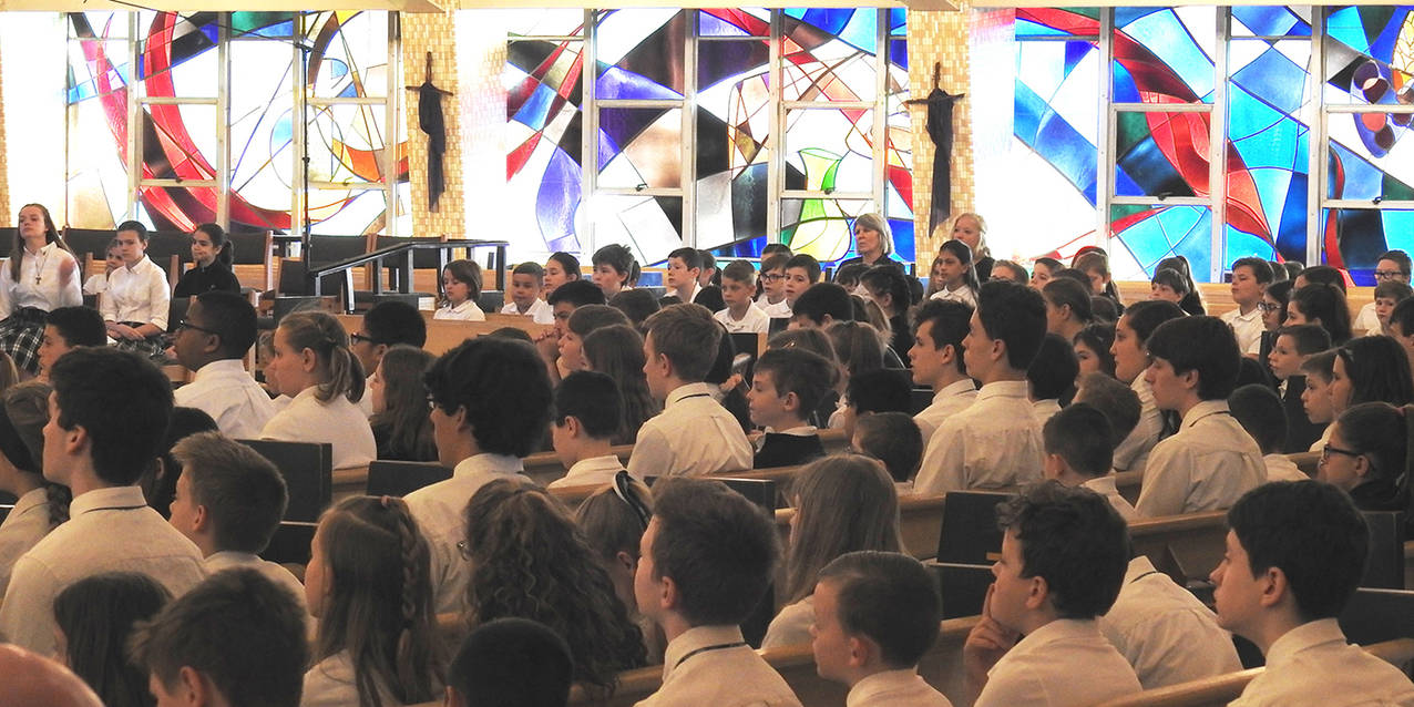 Bishop Perez celebrates Mass, mingles with students at Holy Family ...