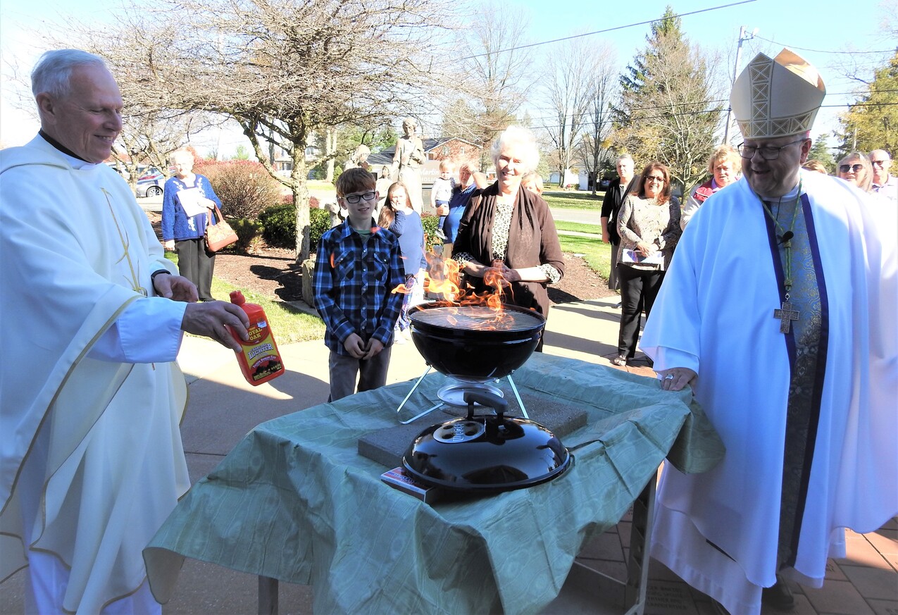 Mortgage burning highlights bishop’s visit to St. Martin of Tours, Valley City