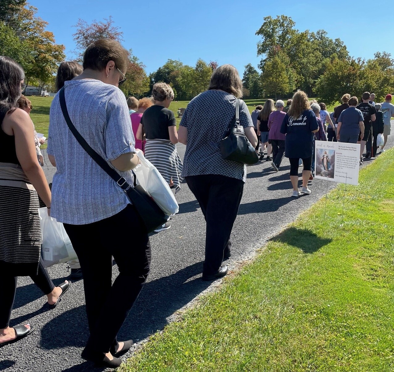 Annual Walk to Remember draws hundreds at seven Catholic cemeteries